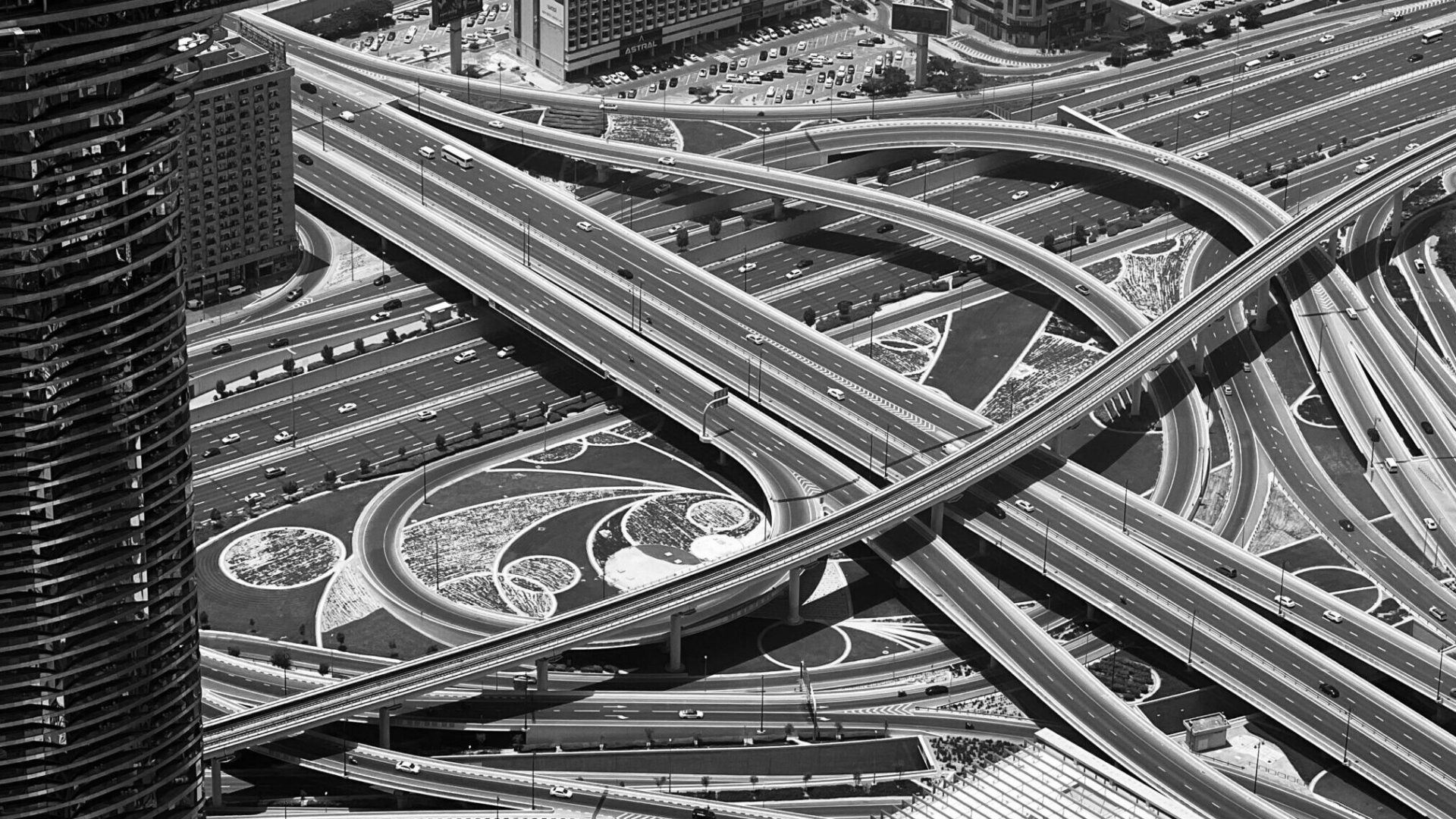 Explore the intricate road network and skyscrapers of downtown Dubai from above.